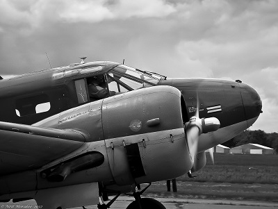 Black and white picture of propeller plane